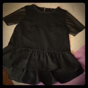 Peplum top with faux leather sleeves